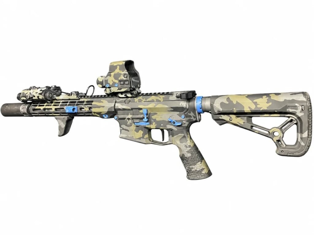 Cerakote multicam AR-15 with blue anodized accents and suppressor by Rock House Firearms in Lufkin, TX